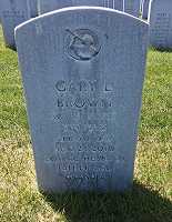 Faded lettering on a granite upright headstone