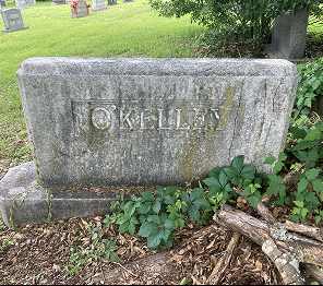 Before restoration: heavily soiled granite headstone